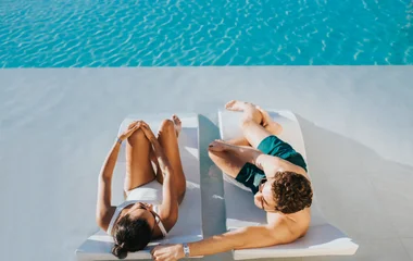 couple hanging out by the pool