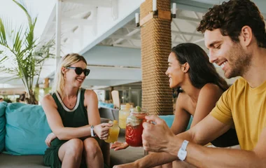 A beach with turquoise water and palm trees