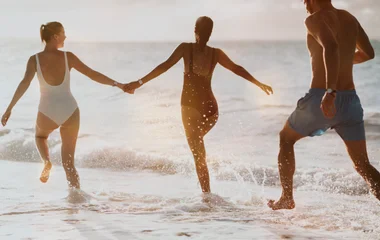 people having fun on beach in turks & caicos