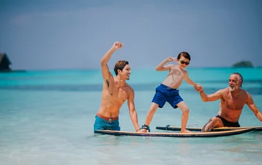 family surfing on holidays