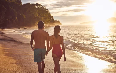 Couple walking on the beach