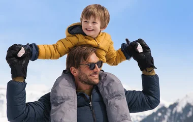 Kid on his father's shoulders