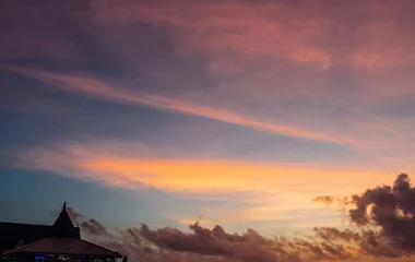 sunset on an over water swimming pool