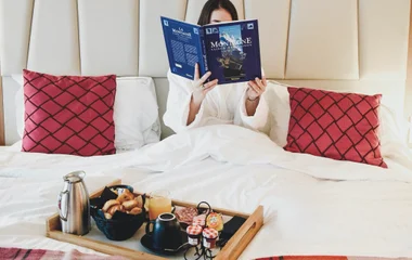 A beach with turquoise water and palm trees