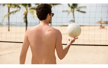 Man playing beach volleyball