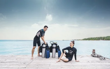 A couple in a diving suit with diving gear