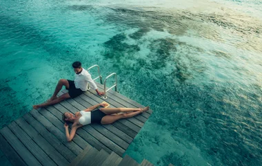 couple on their honeymoon in the maldives