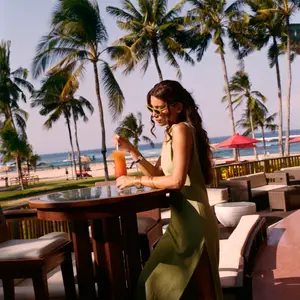 Woman sipping cocktail in Bali