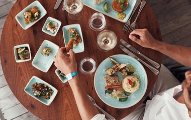 A foodie man enjoying prepared meals in Club Med