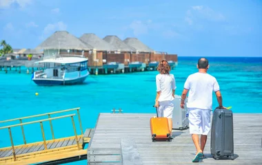 people with suitcases in Maldives
