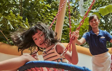 child on swing in club med phuket