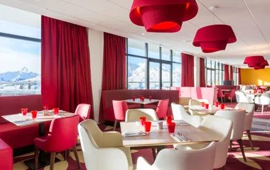 A man and a woman walking on a beach with palm trees