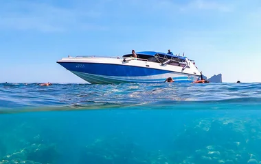 a boat floating near Phi Phi Islands, thailand