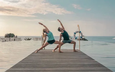 Men and women doing yoga