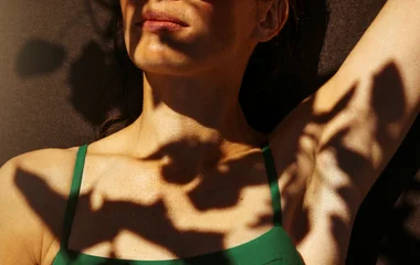 woman under leaf shadow