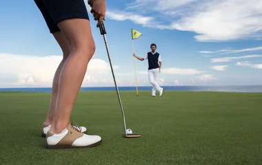 golf teacher with student