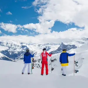 A bunch of people learning how to snowboard at Club Med’s resort