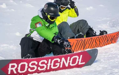 Snowboarders on a slopes