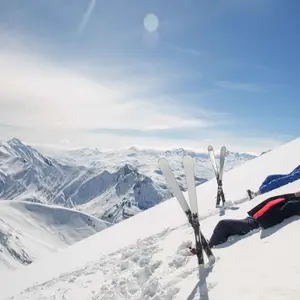 skiers relaxing at the top of the Alps