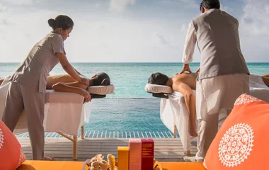 Couple getting a massage with a sea view