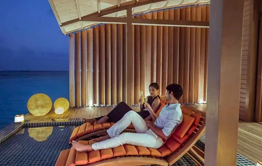 Two people relaxing in one of Club Med's resort in the Maldives