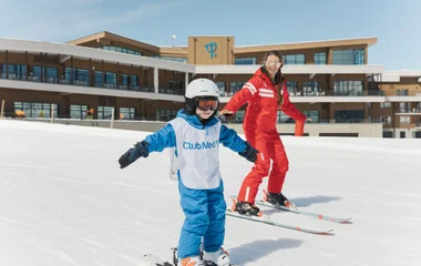 Skischüler und Skilehrer