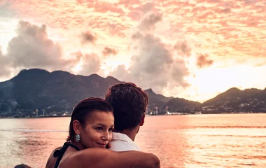 A beach with turquoise water and palm trees