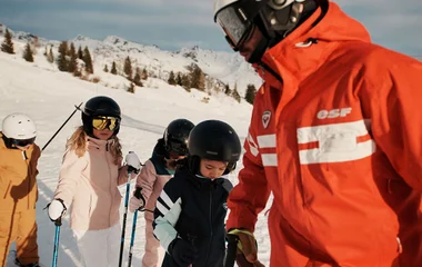Kids learning to ski in the Alps