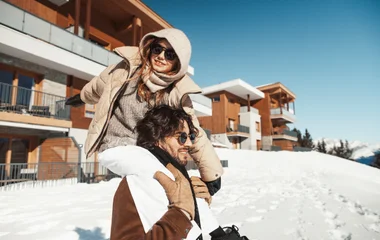 family on the slopes at a ski chalet