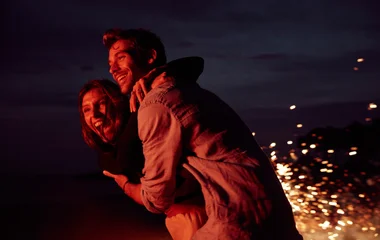 Couple dancing at night on holiday