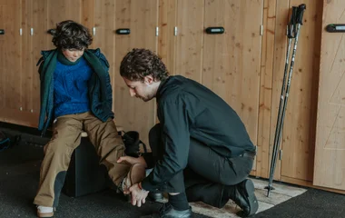 family in a ski locker room