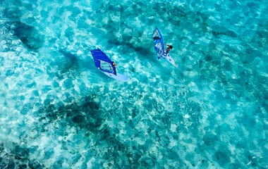 arial shot of people windsurfing