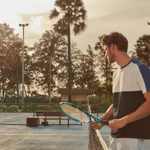 Tennis player on the courts on holiday