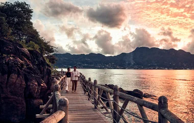 Couple walking on the deck in a Seychelles resort