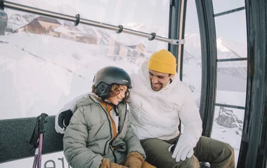 Ski lift child and father