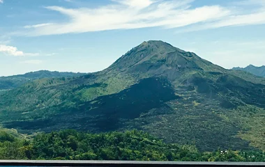 a picture of a terrace with chairs facing towards mount batur