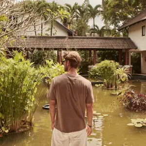 A man watching a pond in Club Med Phuket