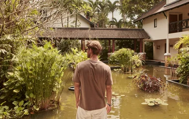 a man watches the pond in Club Med Phuket