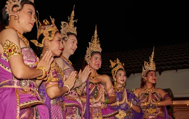 Thai women with traditional clothes dancing