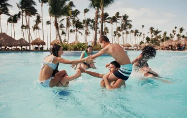 Teens having fun in a pool together
