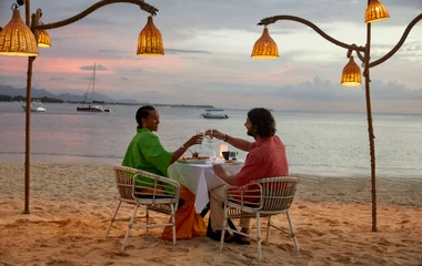 A couple dining on the beach