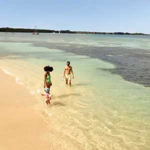 Family enjoying their holidays on the beach