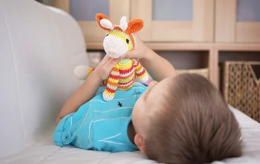 Baby playing with toy.